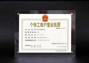 Detail of clear acrylic certificate frame with decorative metal screws and double panel