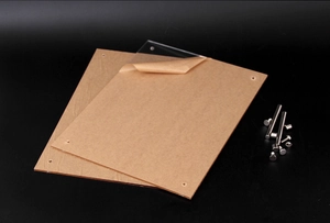 Detailed view of clear acrylic sheets with metal standoff bolts and protective kraft film