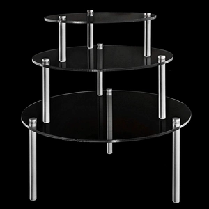 Close-up of a 3-tier black acrylic cupcake stand with polished silver metal support pillars