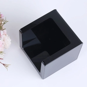 Minimalist black acrylic square napkin box with U-shaped opening on white background