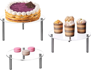 Detail of 3-tier clear acrylic cake stand with polished stainless steel risers for desserts