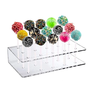 Clear acrylic lollipop holder with 21 holes for candy display on white background