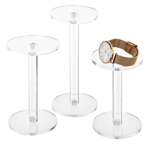 Set of 3 round clear acrylic risers for watch and jewelry display on white background