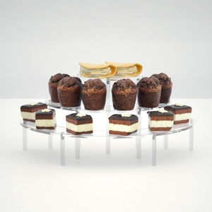 Macro view of clear 3-tier acrylic semicircular display stand with dessert cupcakes