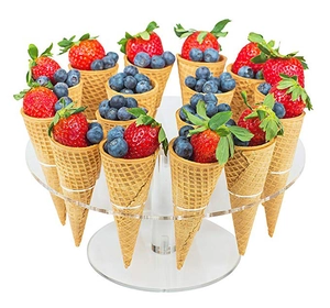 Detail of a 16-hole clear acrylic ice cream cone holder filled with fresh berry waffles