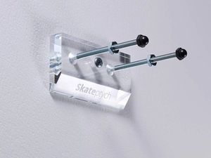 Close-up of clear acrylic wall mount for electric scooters with metal bolts and nuts