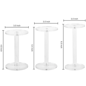 Set of 3 clear acrylic round display risers in three different heights for cosmetics