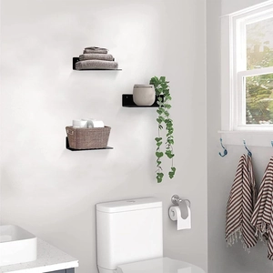 Three-piece set of black L-shaped metal wall floating shelves in a modern bathroom