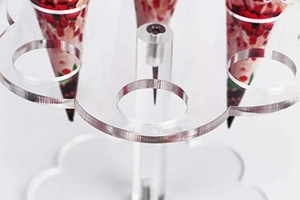 Detailed top view of 6-hole clear acrylic ice cream cone stand with floral design