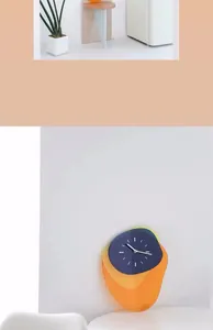 Detail of multi-layered acrylic wall clock with vibrant orange and blue artistic overlays
