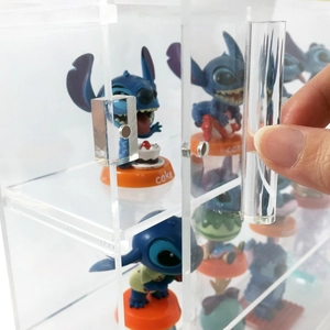 Close-up showing a side-opening transparent acrylic storage box with magnetic door detail
