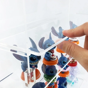 Detail of clear acrylic display box showing smooth opening door for toy collectibles
