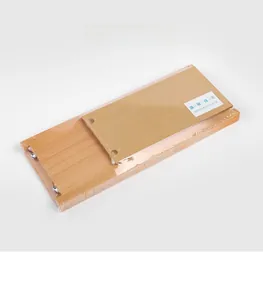 Flat-packed wooden shelf parts in plastic wrap showing natural grain and metal fasteners