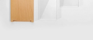 Macro shot of premium beech wood block and clear acrylic jewelry display risers set