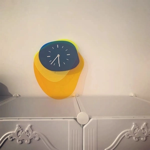 Detail of artistic layered acrylic wall clock with minimalist blue face and sleek modern design