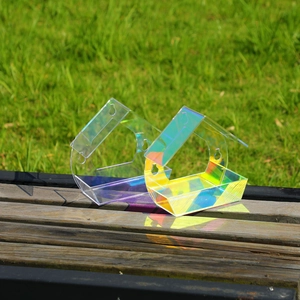 Iridescent acrylic house-shaped bird feeder set with colorful reflective finish on wood
