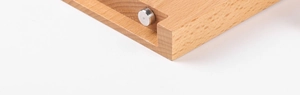 Detailed macro view of acrylic display stand with polished wood finish and metal joint