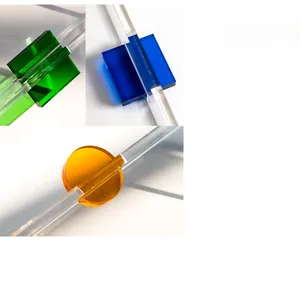 Detail of acrylic handles in Klein Blue, Glaze Green and Vigorous Orange with glossy texture