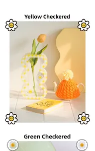 Detail of wavy acrylic checkered flower vase with yellow and green daisy patterns