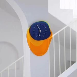 Modern geometric acrylic wall clock with Bauhaus style layered blue and orange design