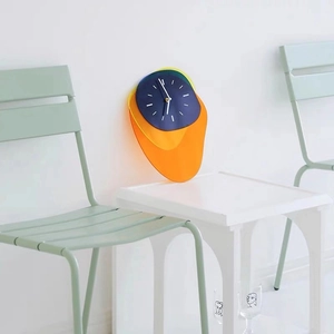 Modern Memphis style acrylic wall clock with colorful layered geometric panels for decor