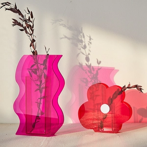 Modern acrylic geometric flower vases in purple and red with minimalist shadow effect
