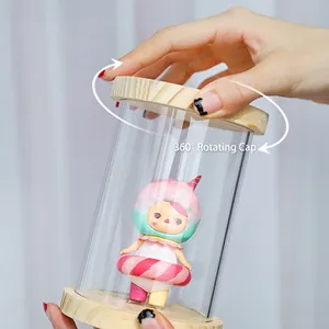 Clear cylindrical blind box display case with wooden lid and 360 rotating screw cap