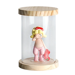 Collectible Roby figurine display in transparent glass case with elegant wood base