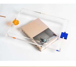 Minimalist rectangular acrylic tray with vibrant orange and blue geometric color block accents