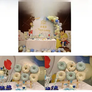 Detail of Little Prince themed party dessert table with acrylic stands and donuts