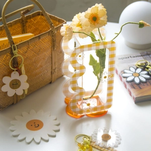 Yellow checkered daisy acrylic wave vase with smiley charm and coaster for home decor
