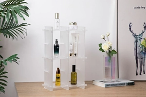 Macro view of modular acrylic desk organizer with white semi-transparent six-grid shelves