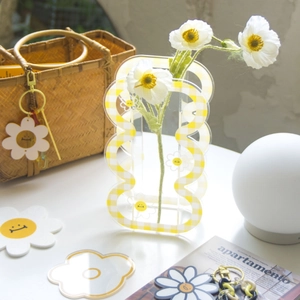 Cute acrylic flower vase with yellow checkered edges and daisy smiley face design