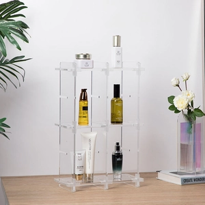Close-up of a three-tier acrylic desk organizer with a modular interlocking structure