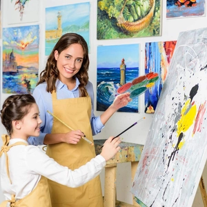 Waterproof yellow art aprons for parent and child with front pockets for painting