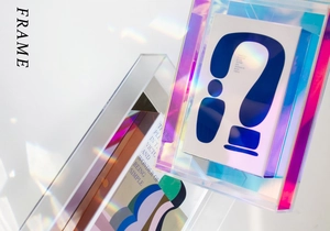 Detail of colorful acrylic picture frames with abstract geometric art and rainbow light flares