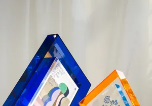 Detail of colorful acrylic picture frame showing transparent blue and orange edges