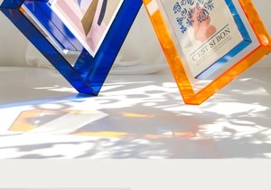 Detail of modern acrylic colorful frames showing light refraction and blue orange texture