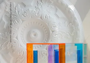 Detail of colorful acrylic display frames showing vibrant orange and purple tones