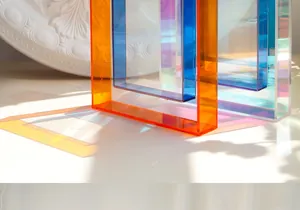 Artistic detail of layered colorful acrylic frames with colorful shadows on a white surface