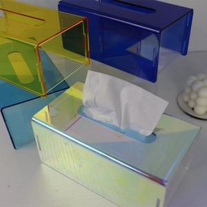 Close-up of acrylic tissue box showing iridescent, blue, and yellow colorful finishes