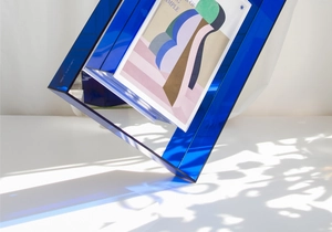 Close-up of deep blue acrylic art frame with elegant light and shadow reflection