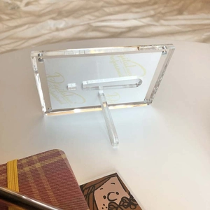 Macro shot of 3-inch acrylic photo frame with magnetic closure and support stand