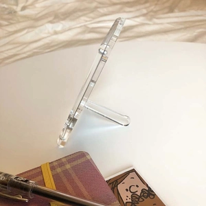Macro view of transparent acrylic frame showing 5mm thickness and support structure