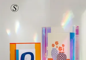 Macro detail of S-size acrylic frame with colorful geometric patterns and rainbow light