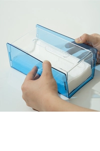 Detail view of transparent blue acrylic tissue box with a modern minimalist design