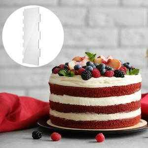 Clear acrylic cake scraper with striped edge for decorating red velvet cakes