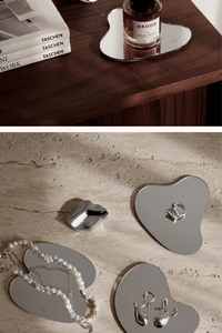Macro detail of irregular acrylic mirror coaster used as a premium jewelry display tray