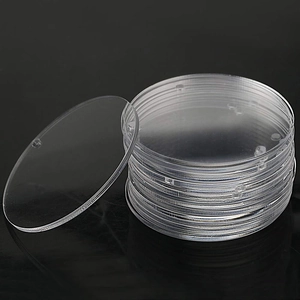 Stack of 10 clear acrylic circles for DIY crafts on reflective black background