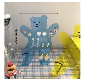 Detail view of acrylic bear jewelry holder with earring holes and 9-inch height display